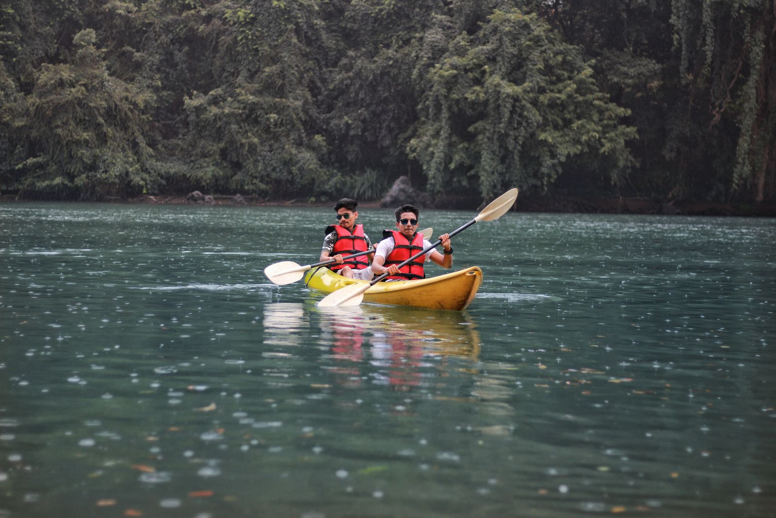 Two people paddling together in a tandem kayak