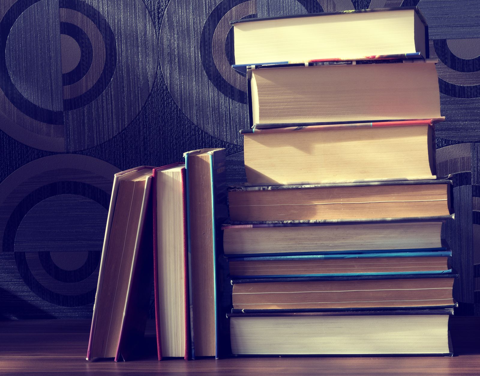 A stack of hardcover books