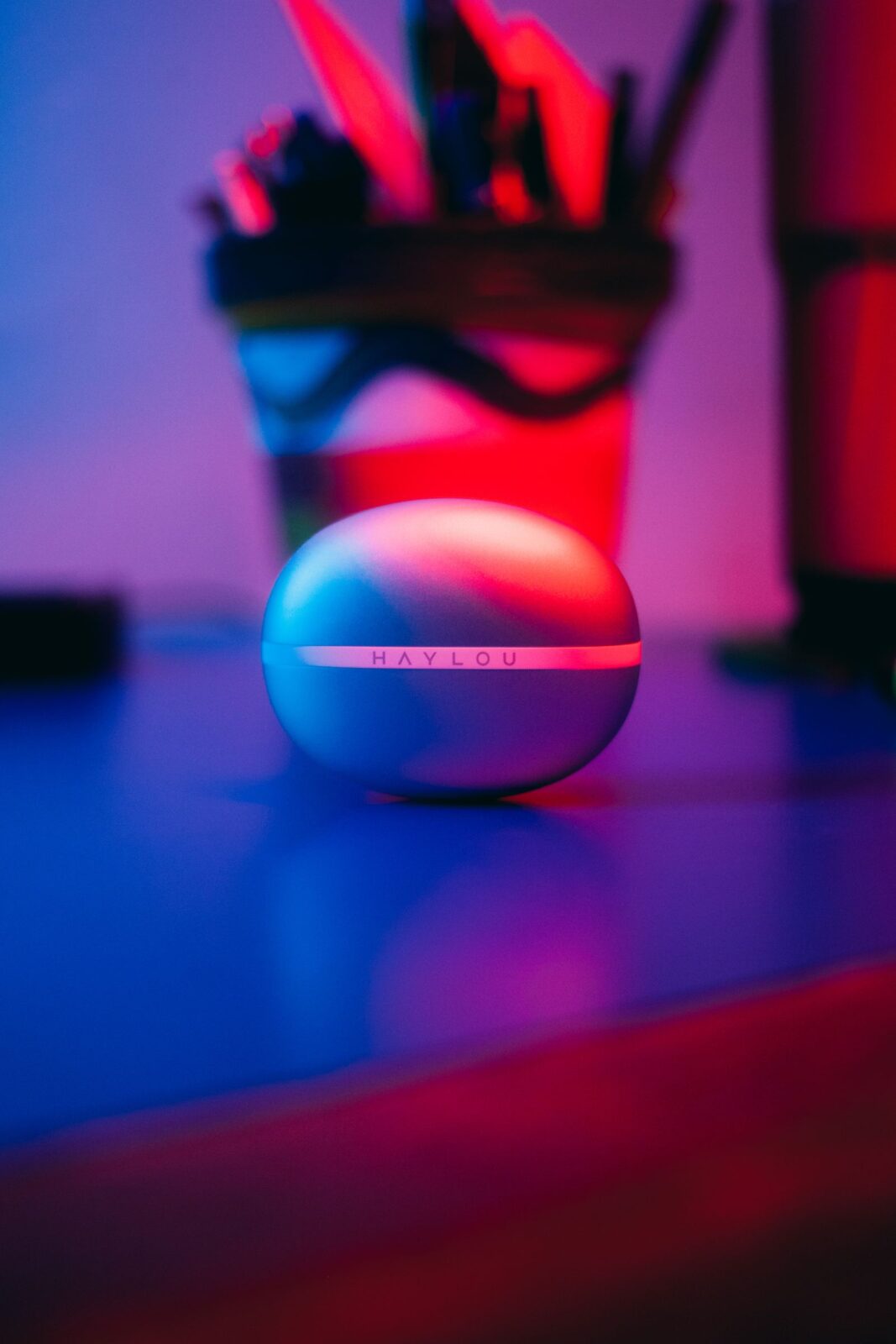 Wireless earbuds resting in an open charging case