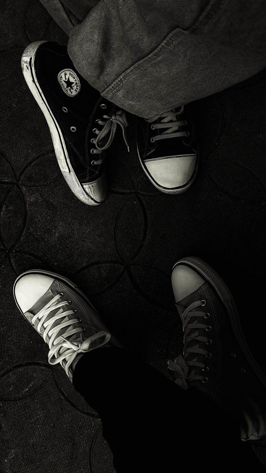 White sneakers worn with no socks visible above the collar
