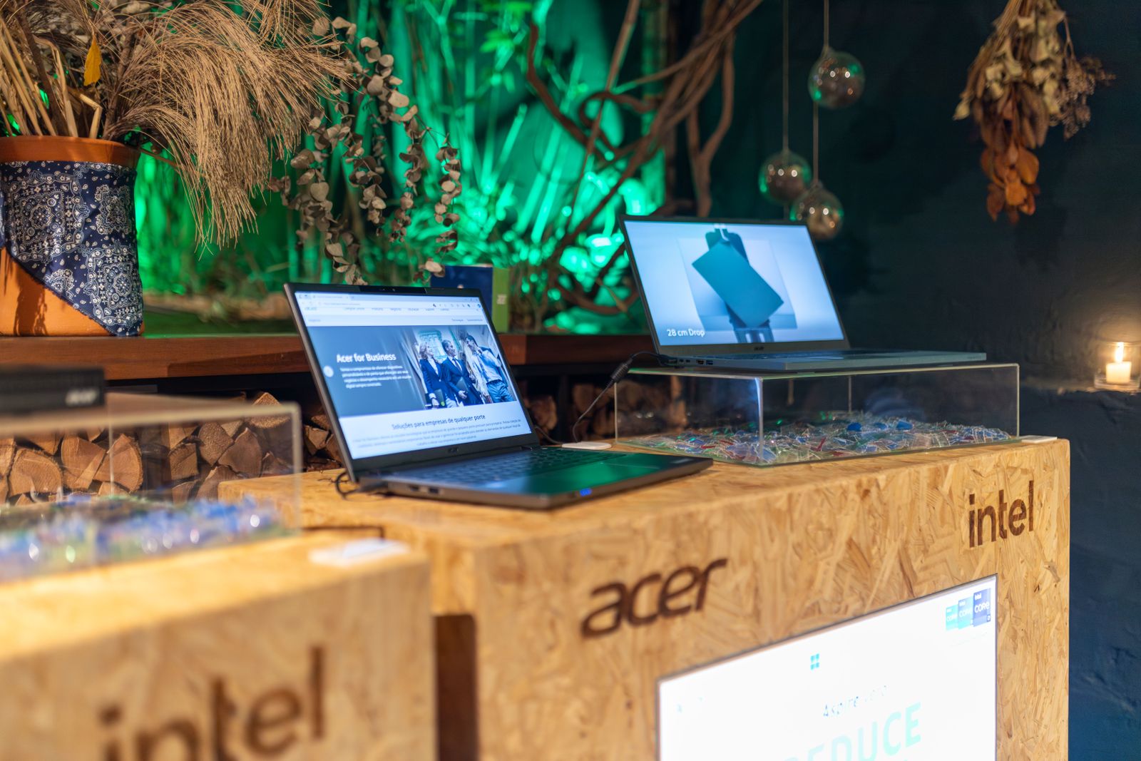 A shopper comparing laptops on a store display shelf