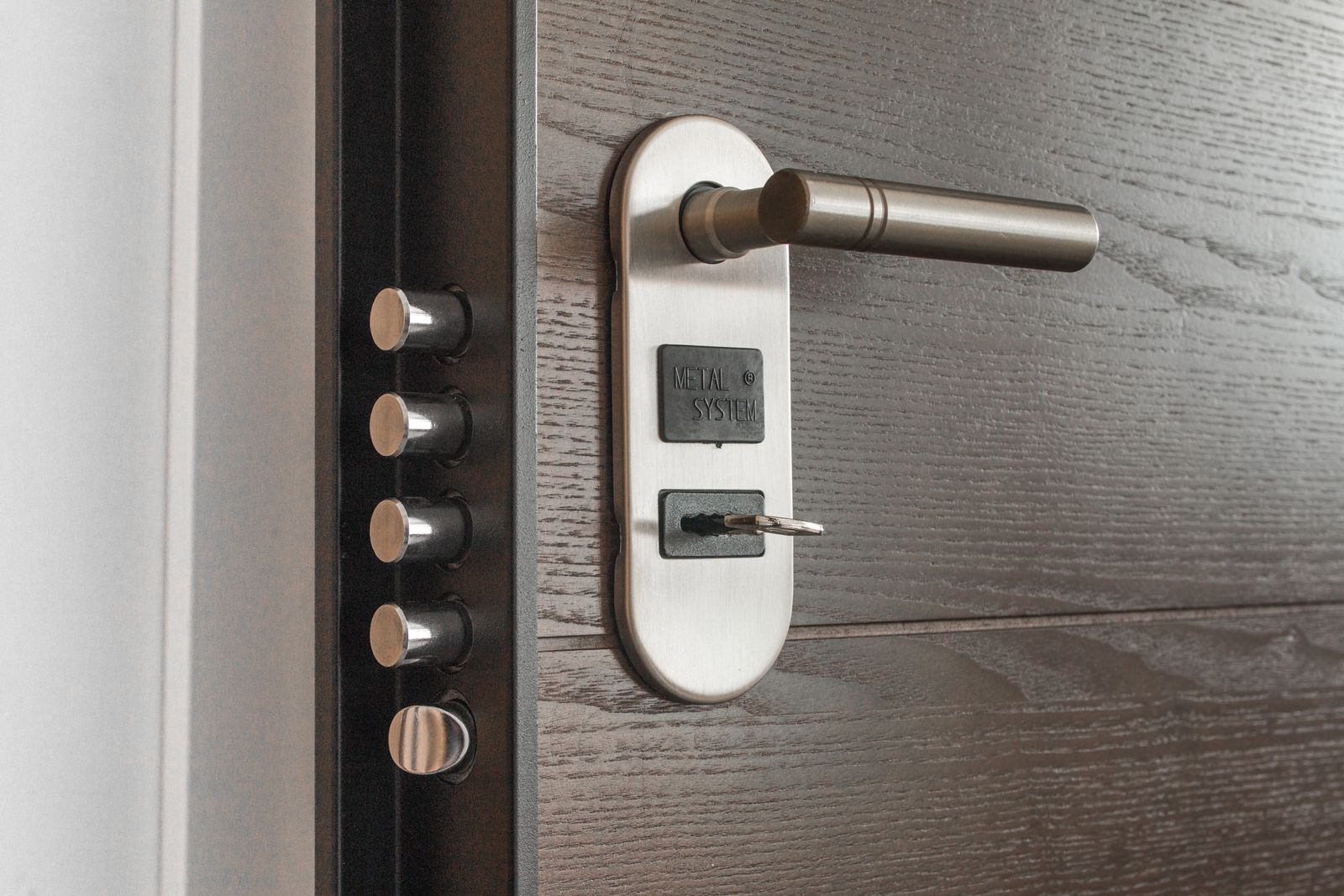 Deadbolt lock on a door with a metal key