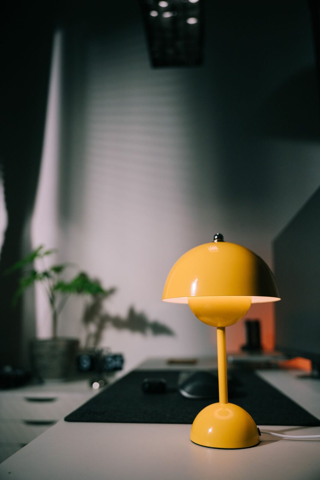 Slim bright-light therapy lamp panel standing on a desk