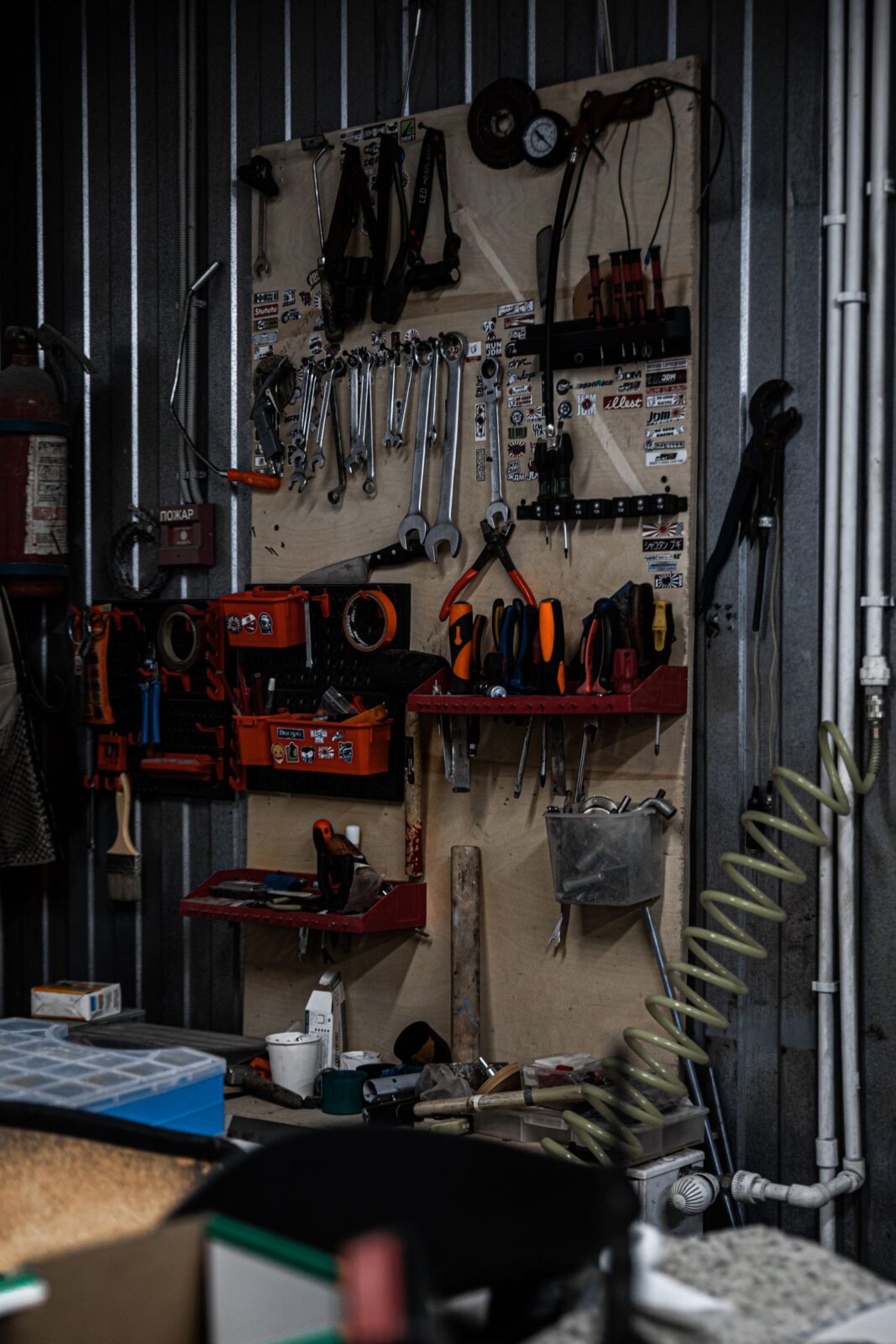 Organized garage with tools mounted on the wall and a clear floor