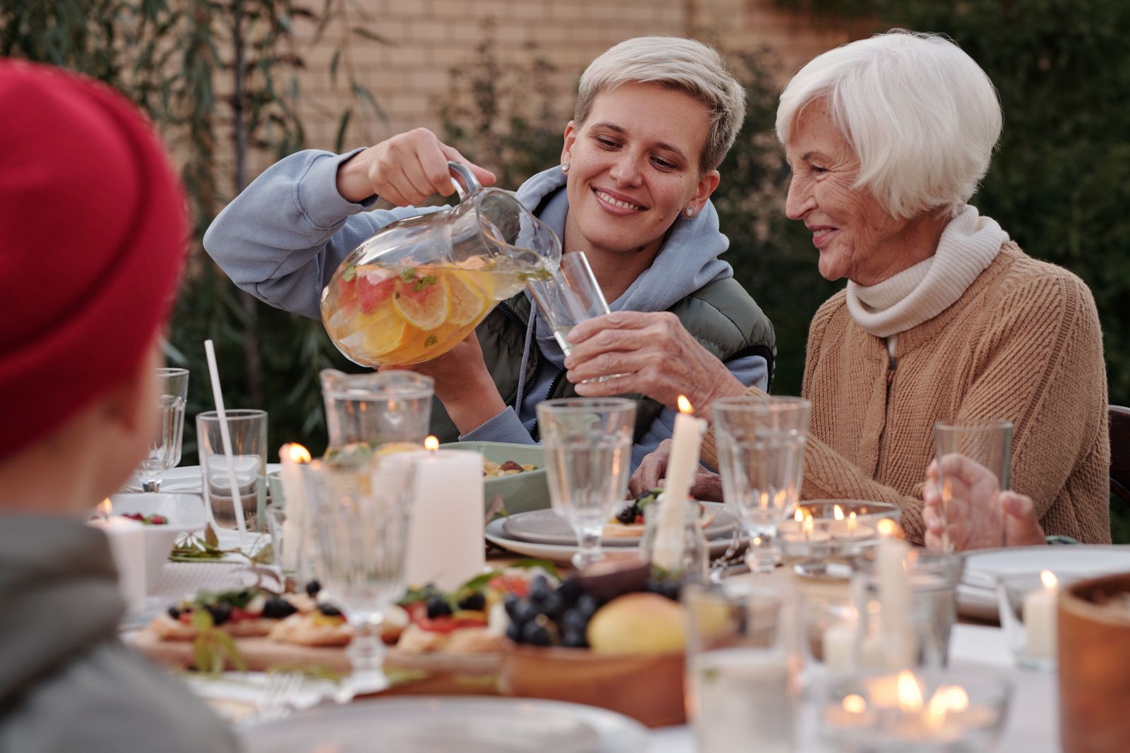 Cheerful family gathered together having a party in a backyard