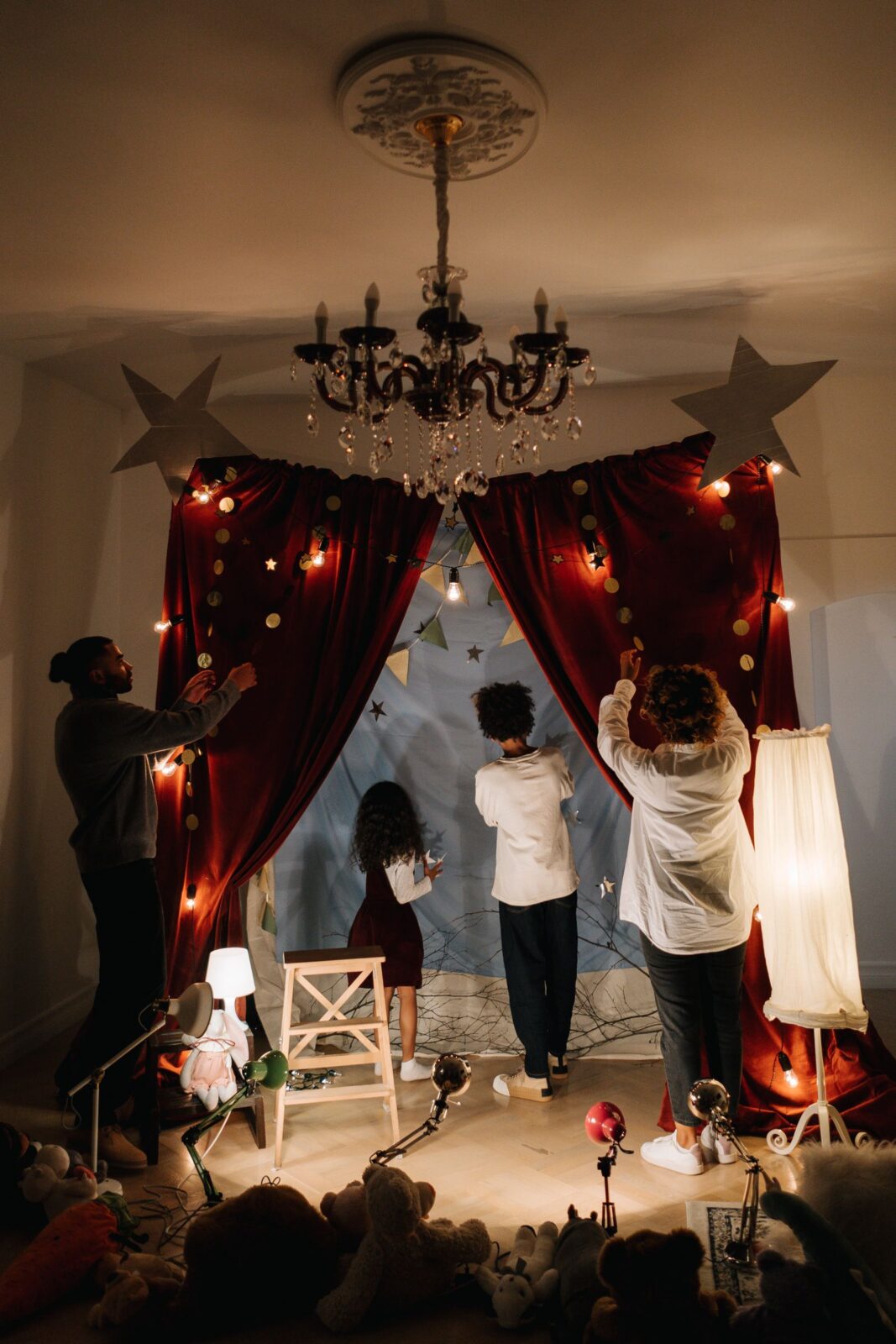 People setting up a home theatre sound system in a living room