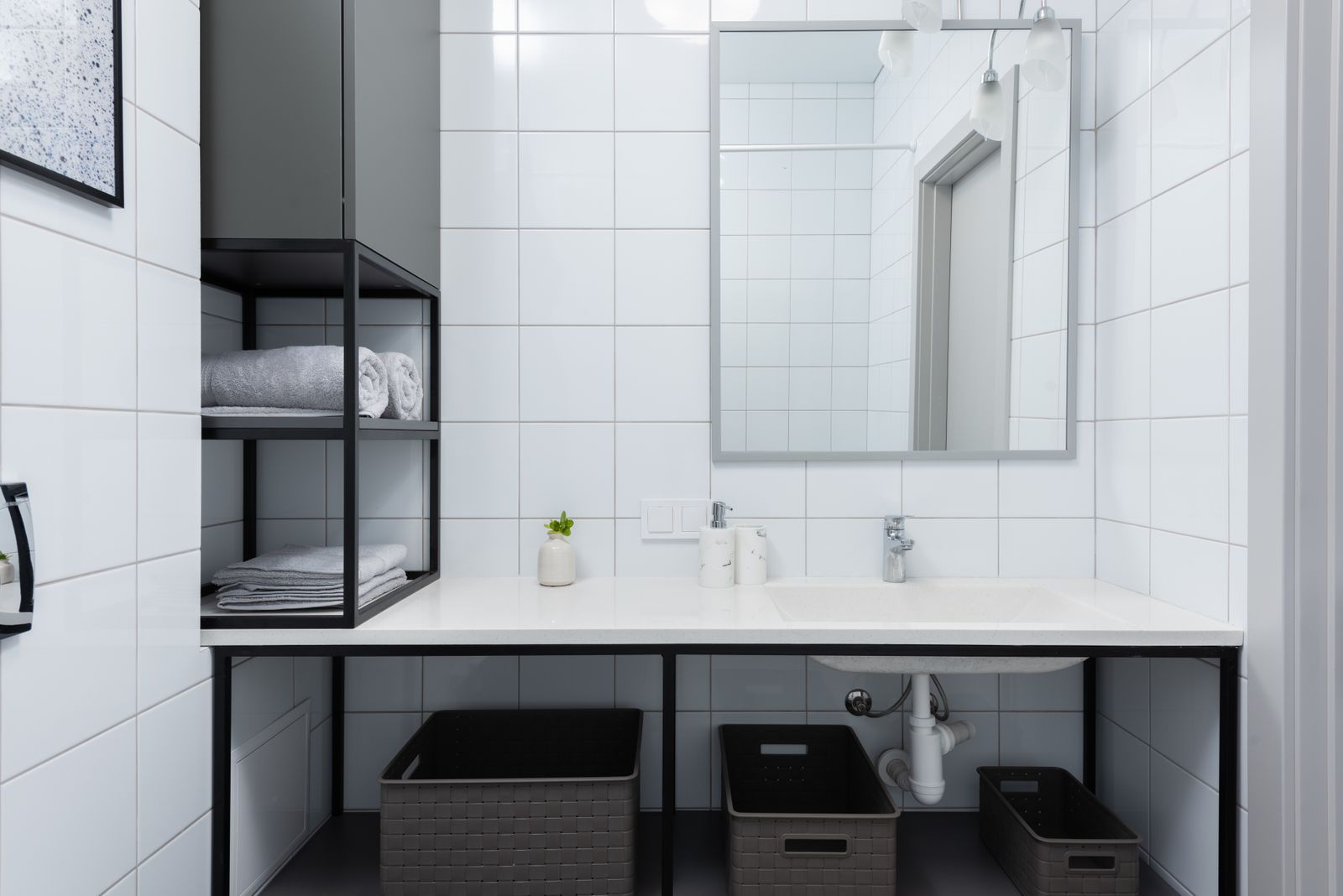 A countertop water flosser on a bathroom counter