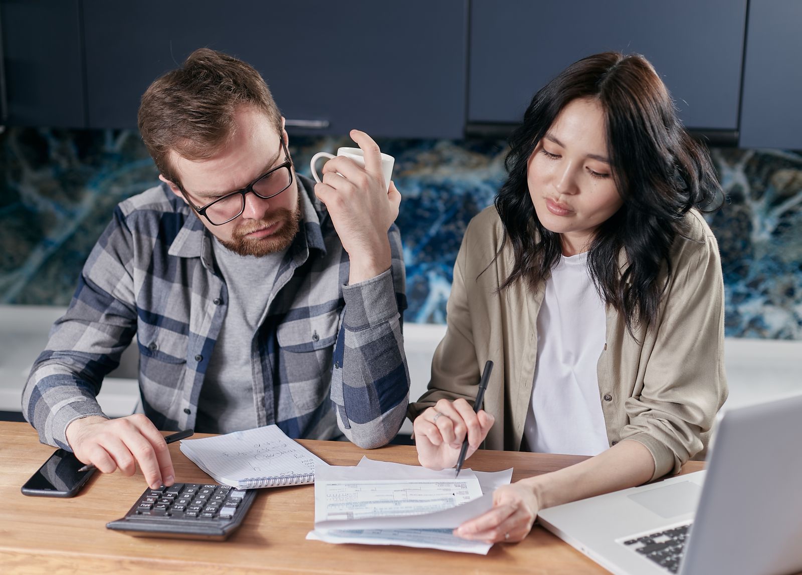 A couple reviewing their finances together at a table