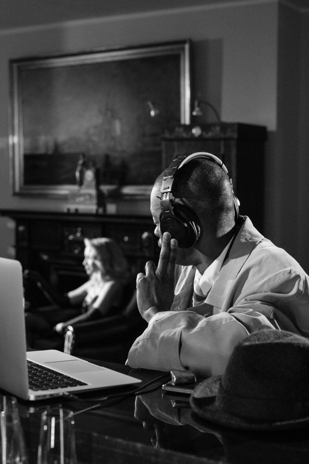 A person attentively listening to audio through headphones