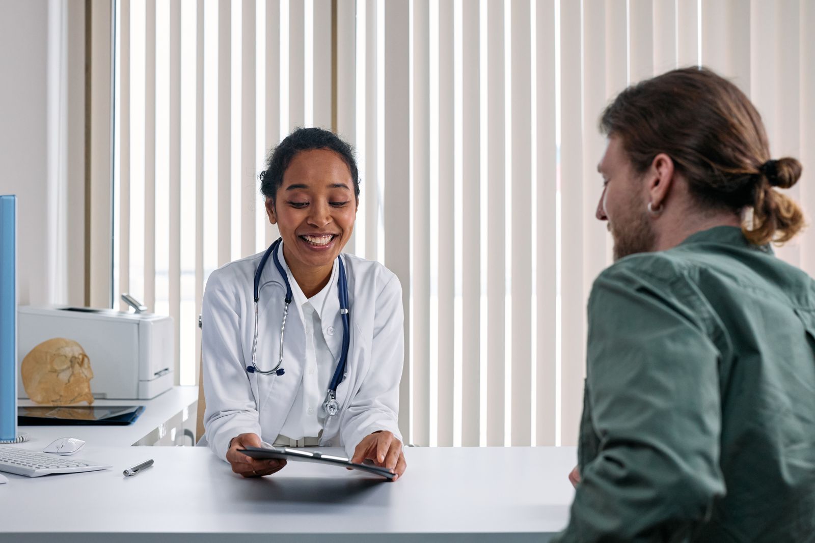 A doctor talking with a patient during a consultation