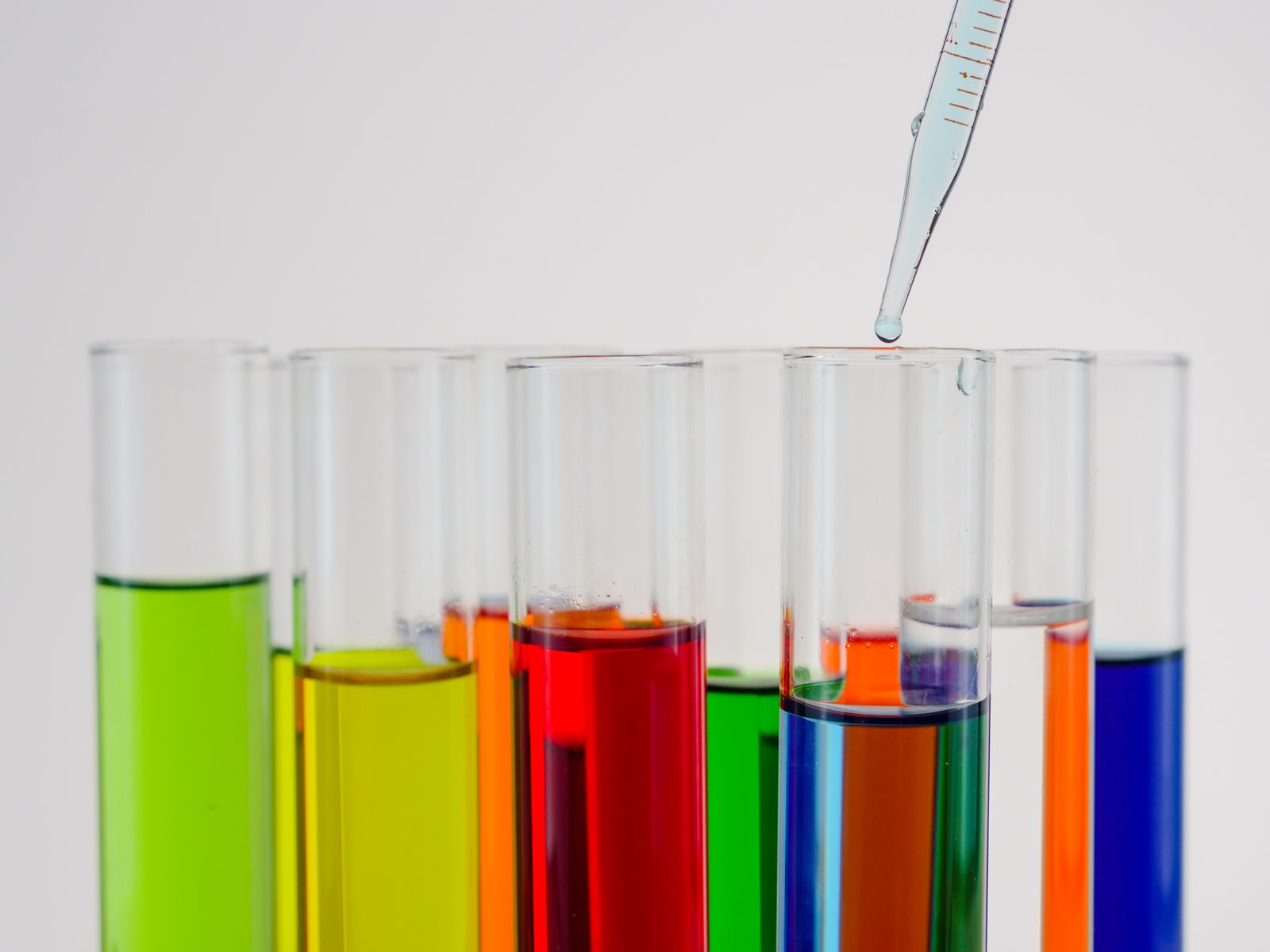 Colorful liquids in test tubes representing a liquid water test kit