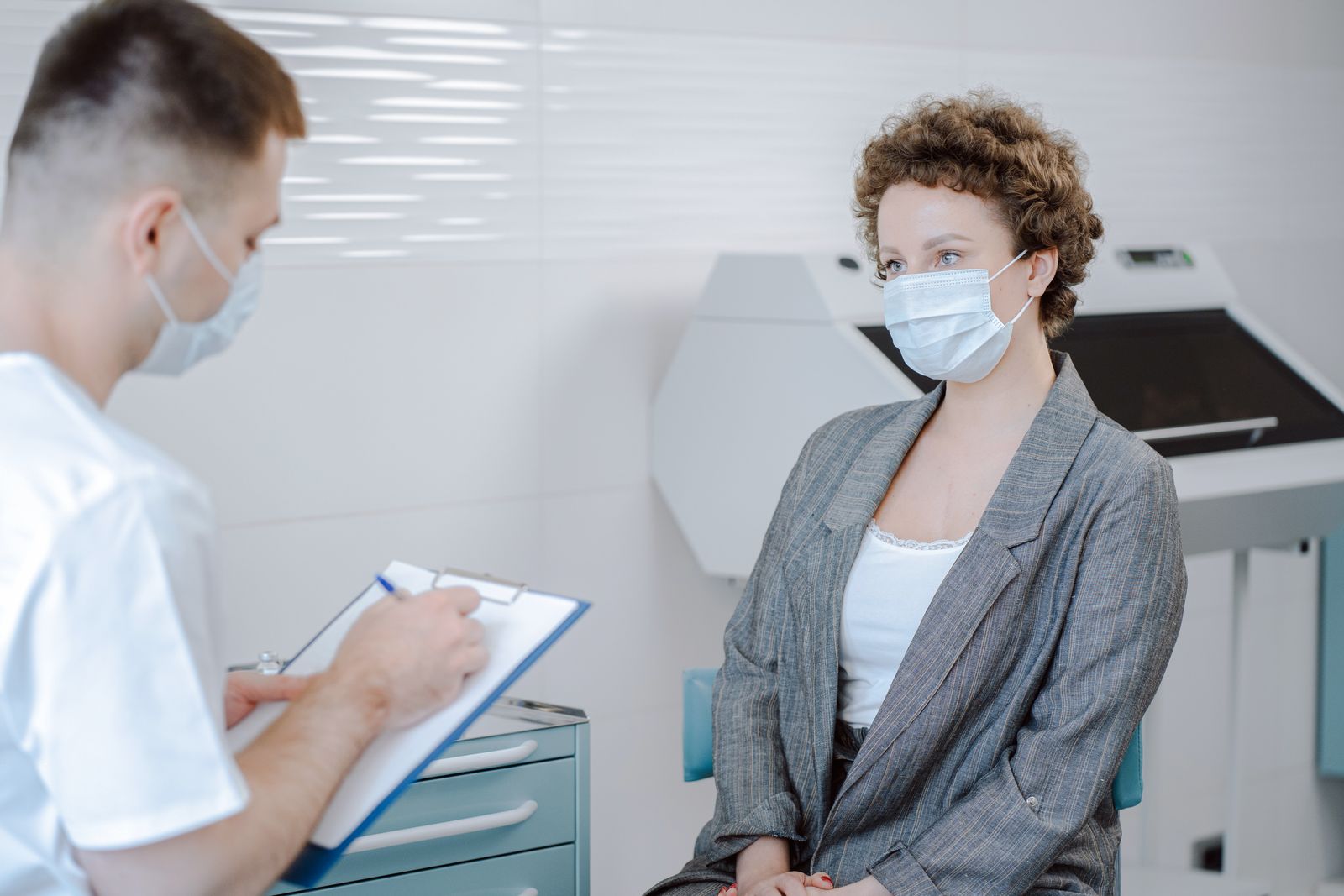Doctor and patient talking in a medical office during a consultation