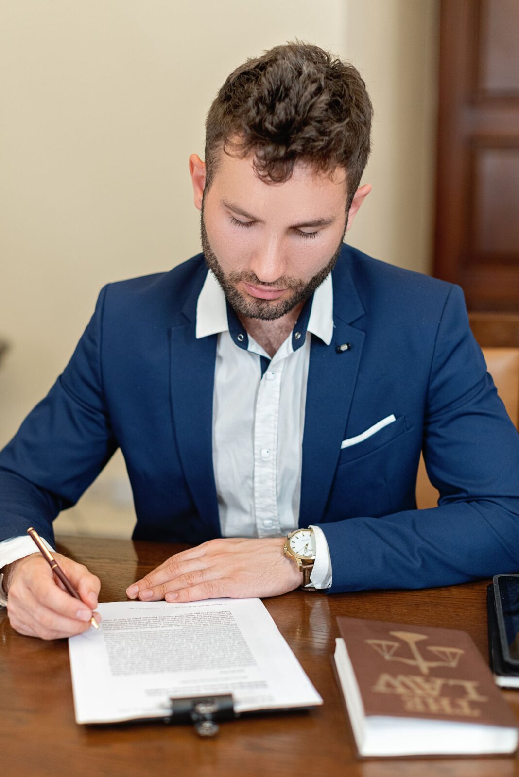 A person carefully reading the fine print of a contract