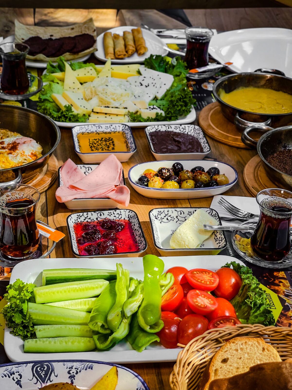 Table full of Mediterranean-style dishes and fresh food