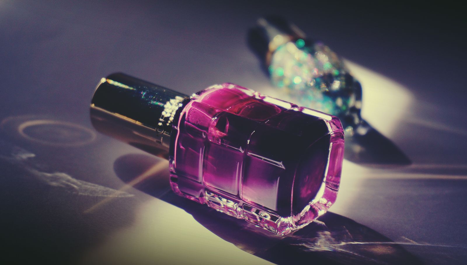 Close-up of a pink nail polish bottle, representing non-toxic and clean nail polish brands