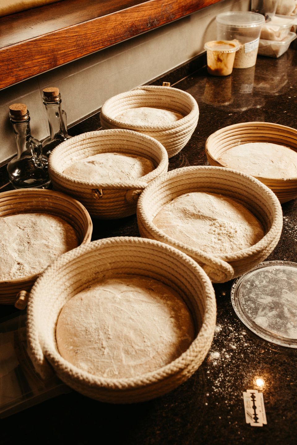 Shaped sourdough dough proofing in a cloth-lined basket before baking