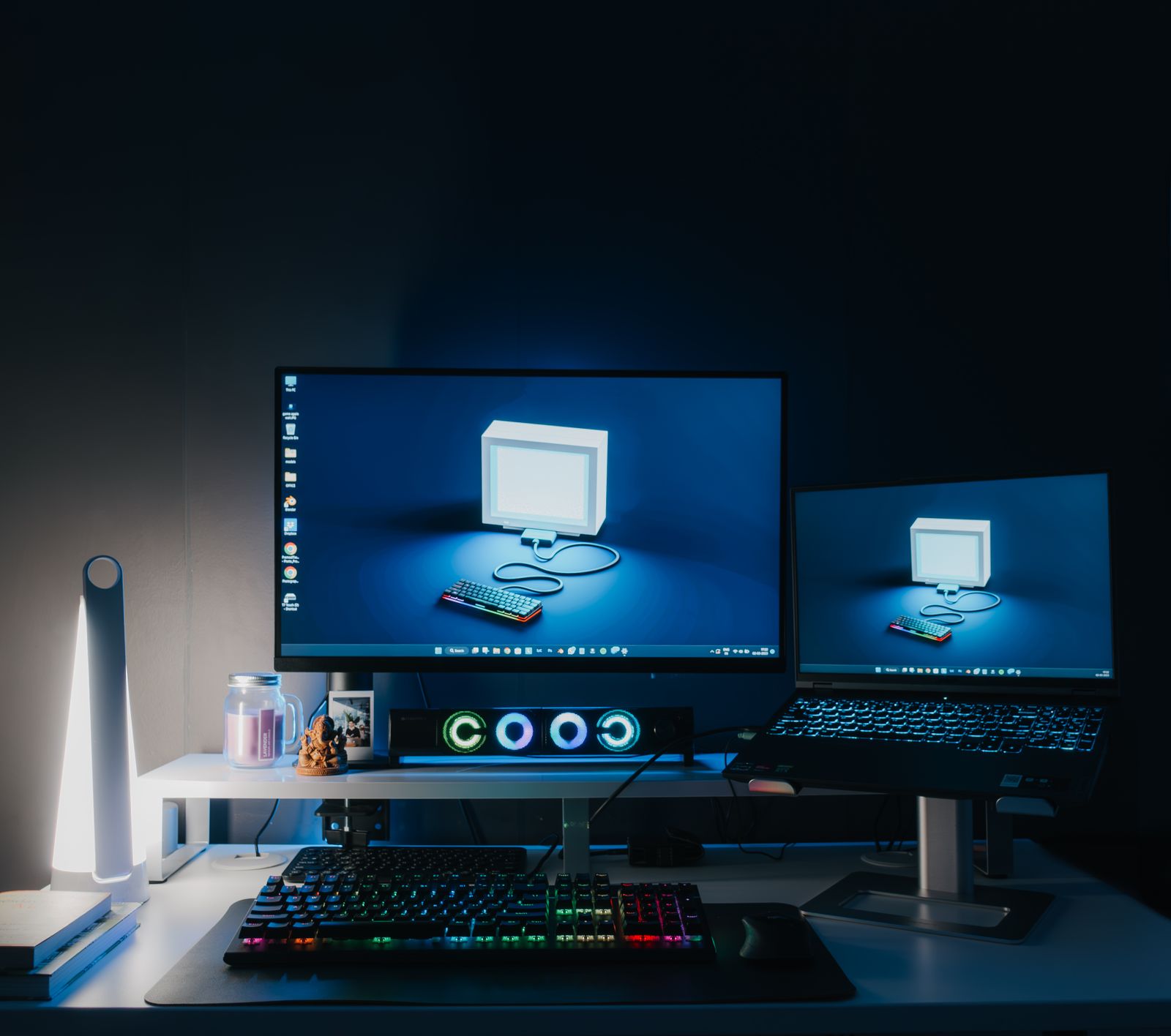 A home office desk with two computer monitors connected through a docking station
