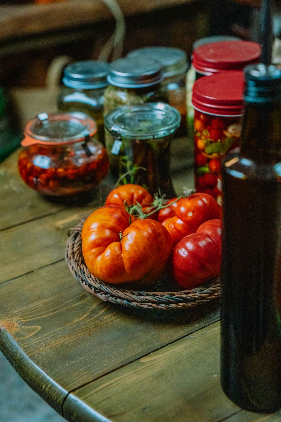 Rustic kitchen table set with fresh and pickled vegetables, evoking home-cooked, diabetes-friendly meal planning