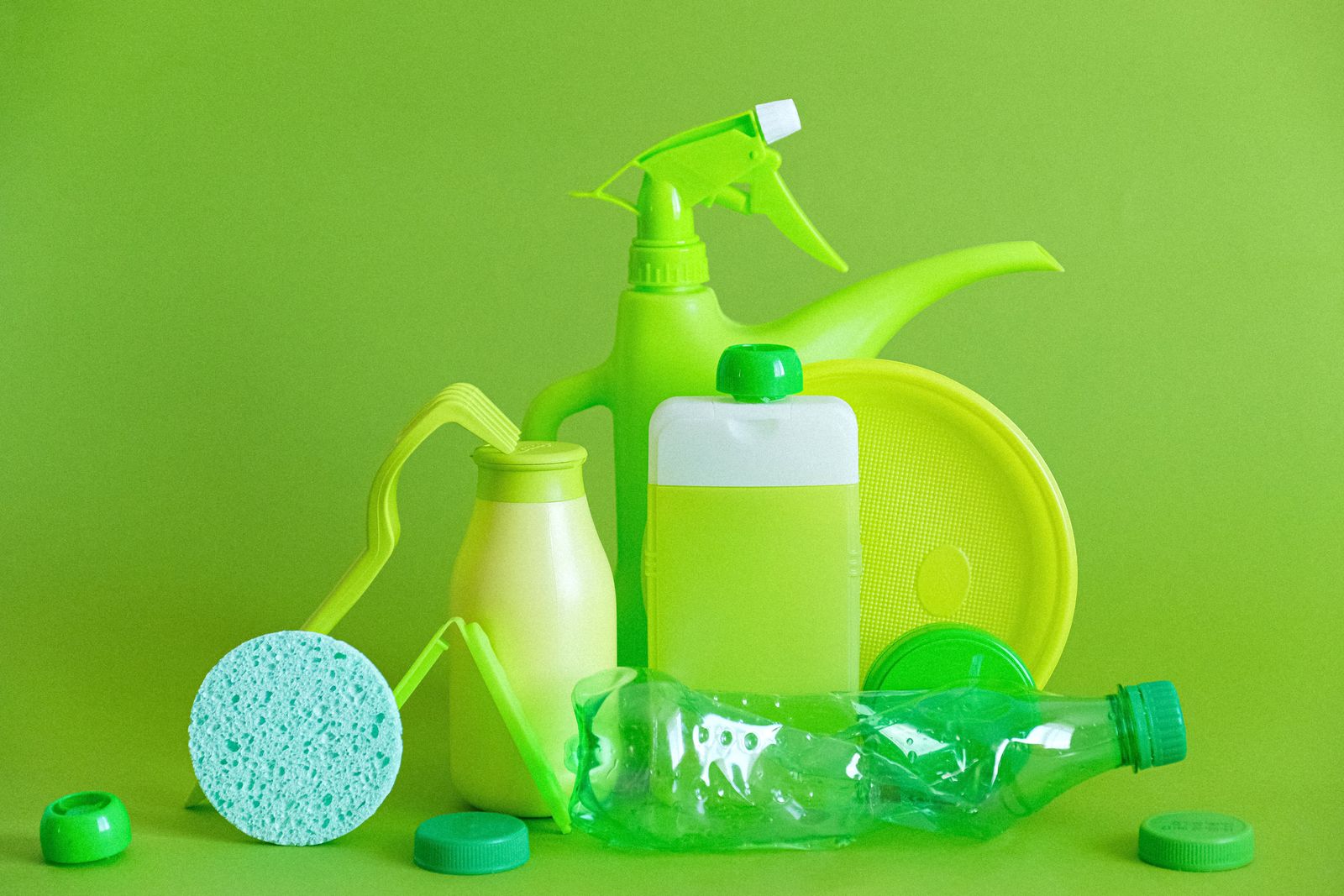 Reusable kitchen containers and cleaning supplies styled together to represent cutting single-use plastic