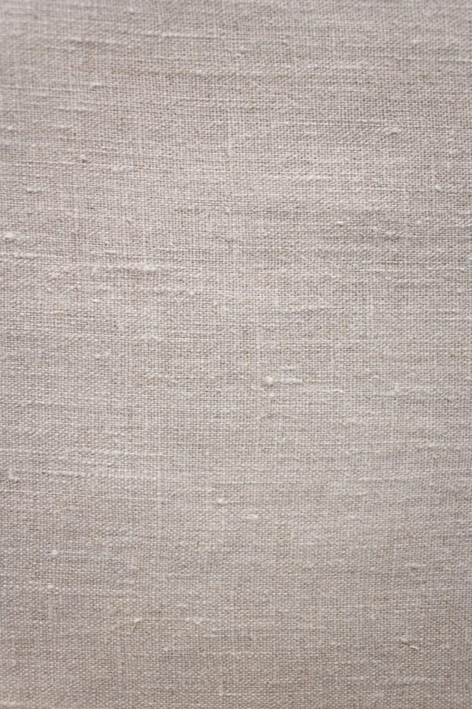 Close-up of textured brown linen fabric weave
