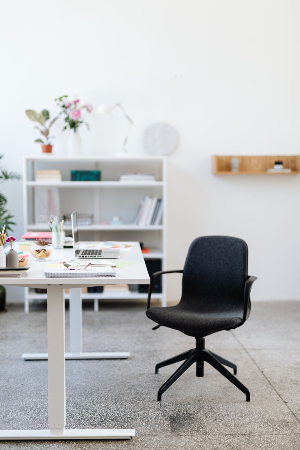 Ergonomic office chair at a desk in a bright, minimal home office