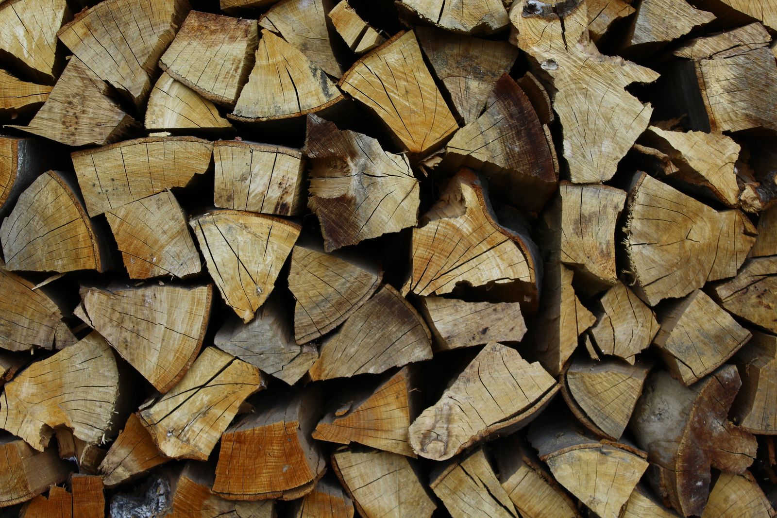 Split firewood stacked with the cut ends facing out